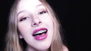 Flirty blondie stunner with braces is frolicking with her boobs in front of the camera