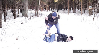 Barefoot Claudia is captured in the cold winter forest