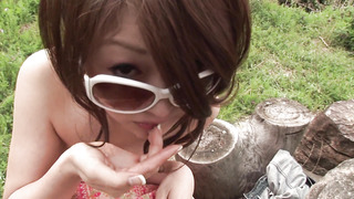 Asian cutie engaging in a nice place: A blowjob in the garden