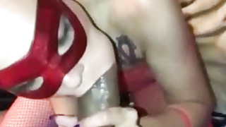 Hooded honey is dressed in a crimson, fishnet costume while providing a oral job to a insane stranger